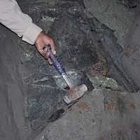 Adit wallrock, with potassic alteration, and massive chalcopyrite and bornite