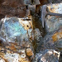 Altered intrusive with quartz-sericite-limonites and copper mineralization